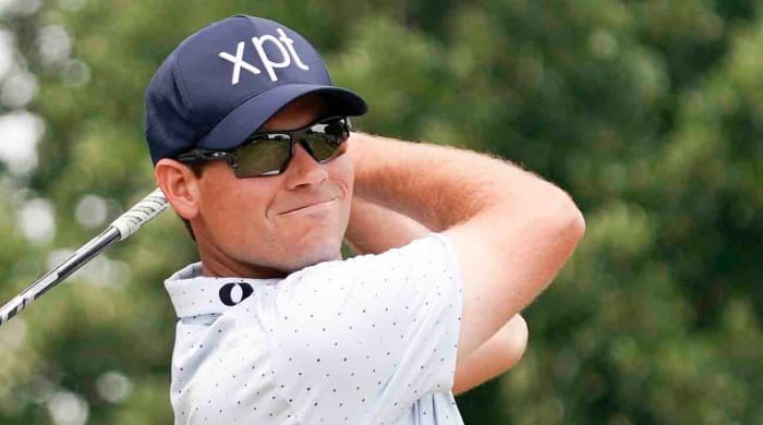 Adam Schenk watches a drive at the 2023 Charles Schwab Challenge.